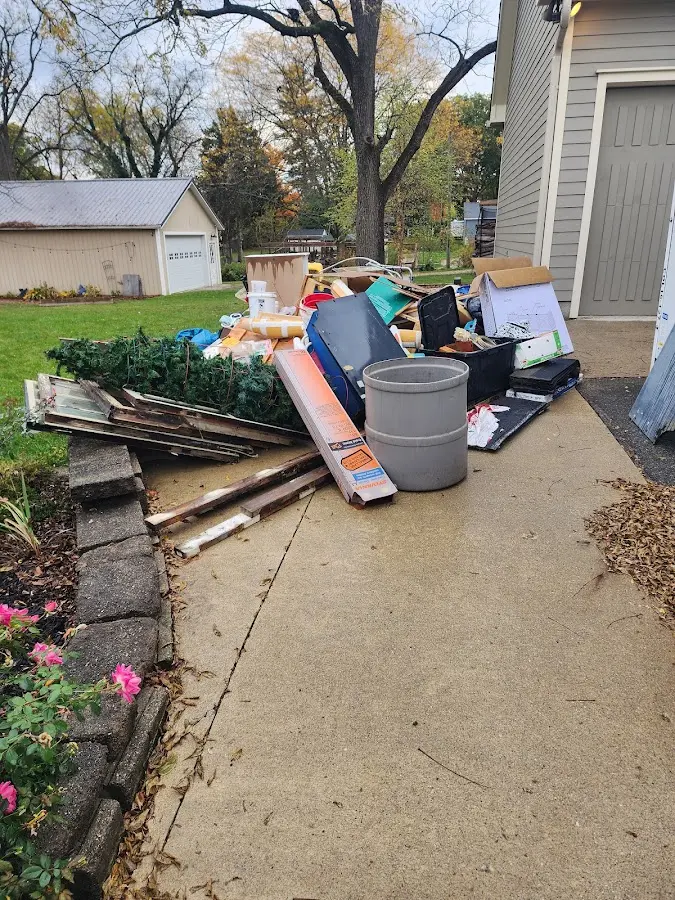 Dumpster being loaded with debris for 3 Yard Dumpster Rental in Cottonwood